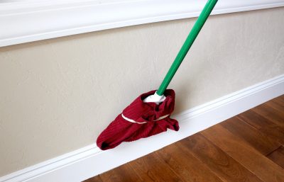 Use A Broom To Clean Base Boards