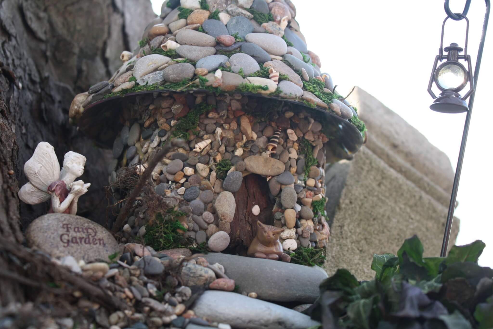 Pebble-Pasted Bottle Fairy House