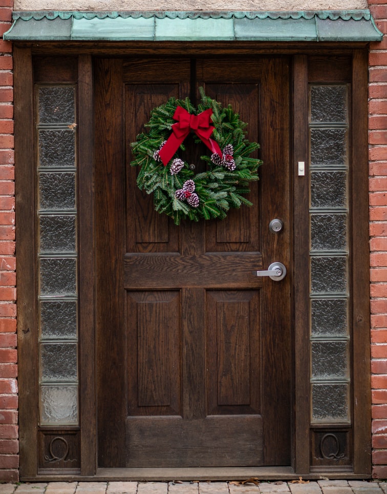 Wreath On Front Door With Red Bow