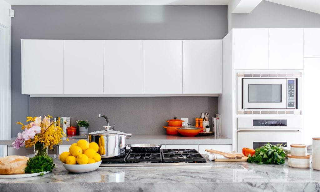 Grey kitchen walls with white cabinets