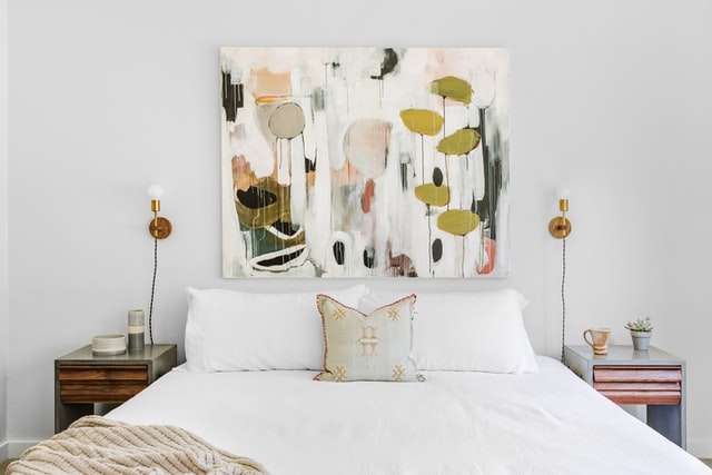 Oversized painting above bed