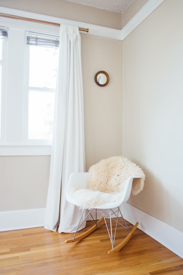 Cream walls and white curtains