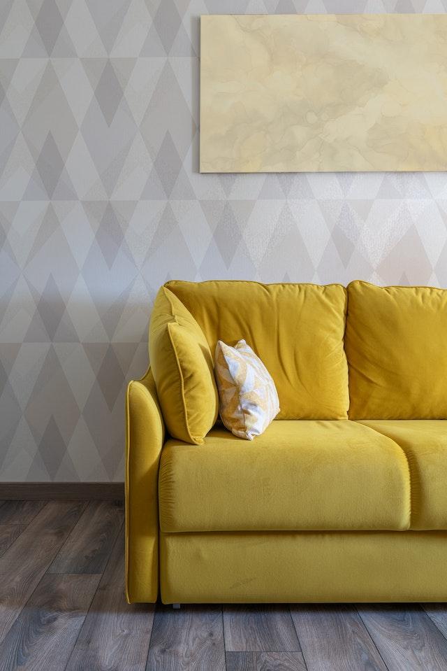 yellow couch for gray walls