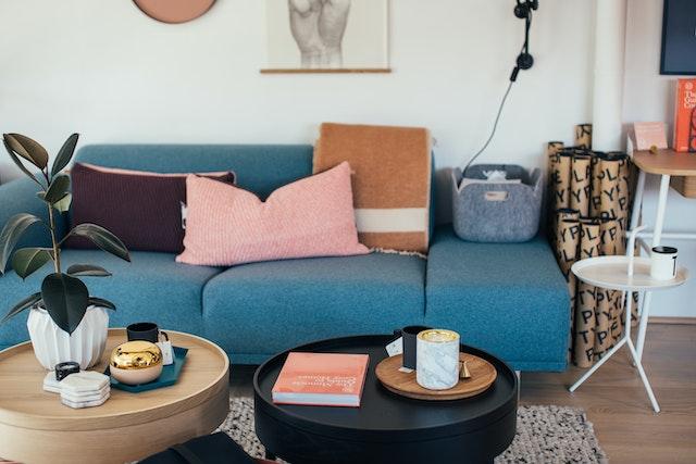 black coffee table with blue couch