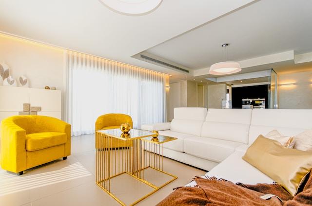 white sofa and yellow color scheme